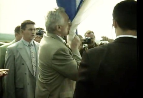 Franjo Tudjman kisses the Croatian flag in liberated Knin August 6, 1995