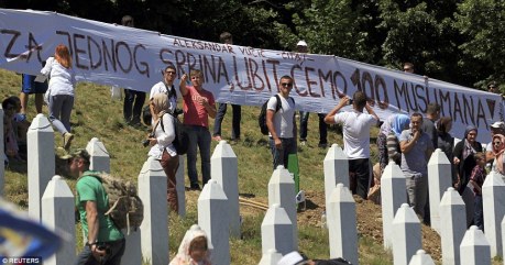 Srebrenica Memorial Cemetery Saturday 11 July 2015 Several banners were held up with slogan or quote of what Serbia's Prime Minister Aleksandar Vucic said in 1990's: "For Every Killed Serb, We Will Kill 100 Muslims!" 
